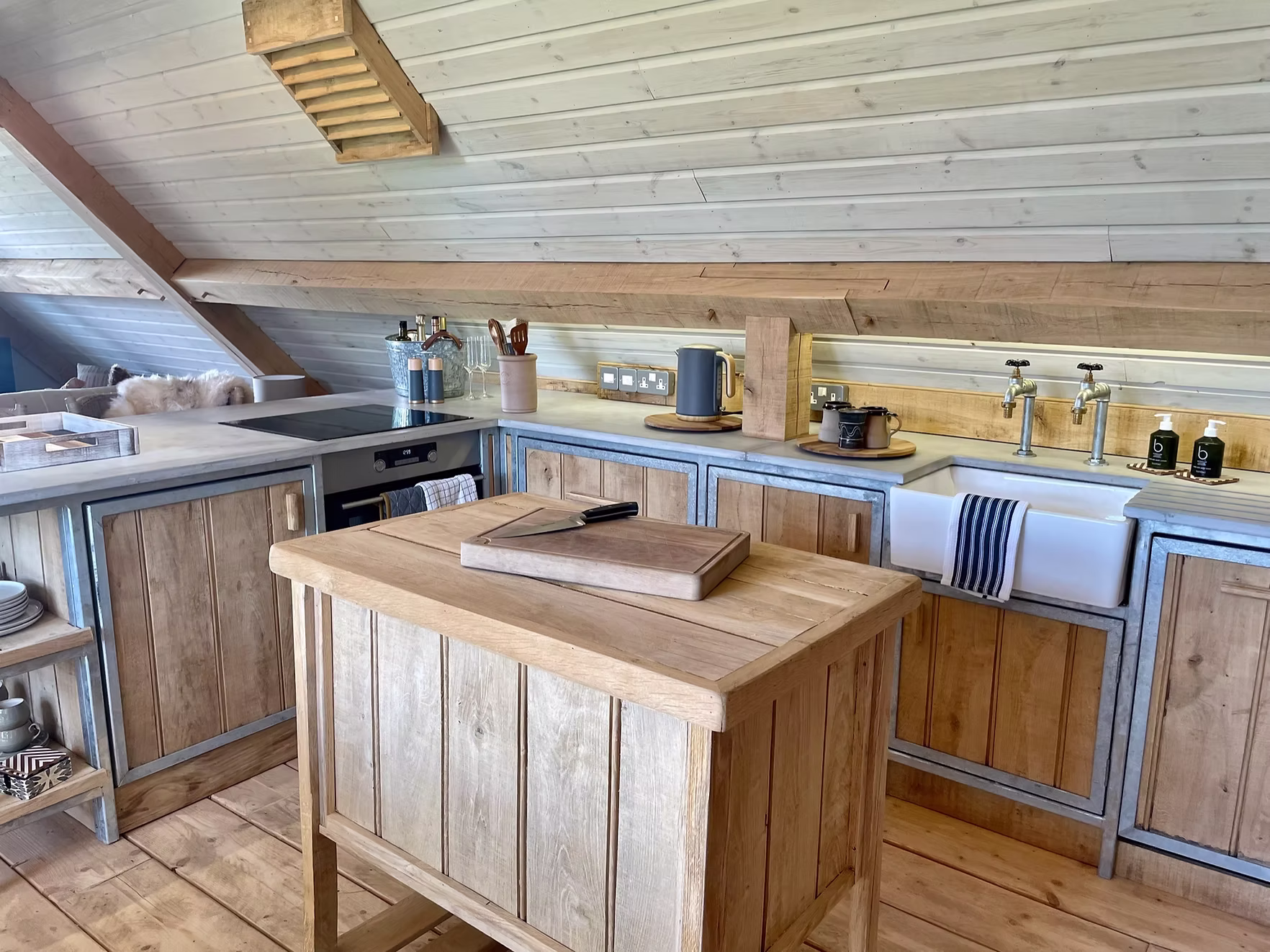 Kitchen with farmhouse sink and pale wood